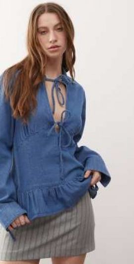 Reclaimed Vintage Reclaimed Vintage long sleeve denim tie front top with peplum hem in mid blue