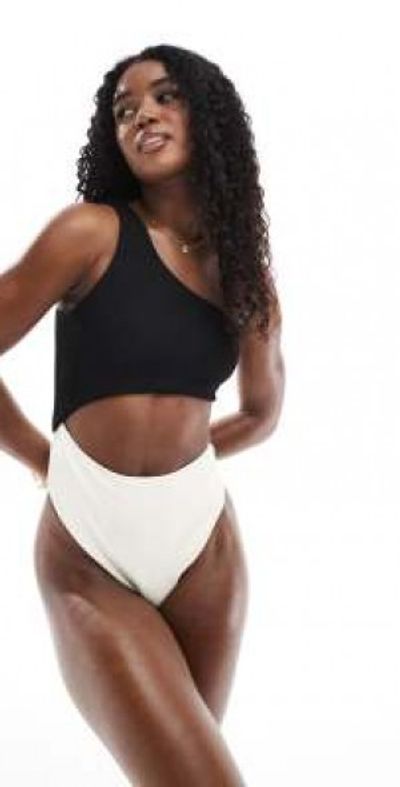 The Frolic The Frolic exclusive one shoulder cut out swimsuit in black and cream color block