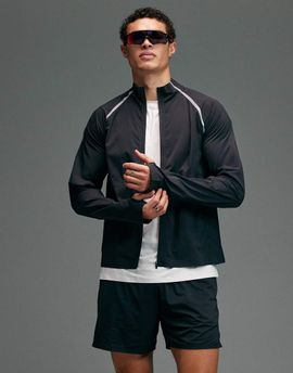 4505 4505 Premium woven water repellent running jacket with zip pockets and reflective detailing in void black