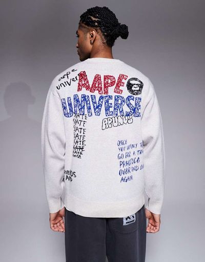 AAPE BY A BATHING APE® Aape by A Bathing Ape knitted sweater in off white with placement scribble print