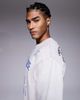 AAPE BY A BATHING APE® Aape by A Bathing Ape knitted sweater in off white with placement scribble print - 4