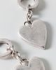 AllSaints AllSaints Heart Charm Huggie Hoop Earrings in Silver, Women's at Urban Outfitters - 1