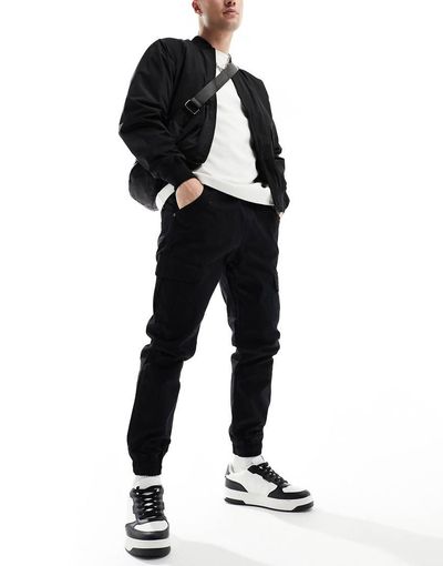 Another Influence Another Influence cuffed cargo pants in black
