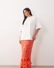 ARRANGE ARRANGE Curve futurist sequin fringe hem midi skirt in tomato-Orange - 1