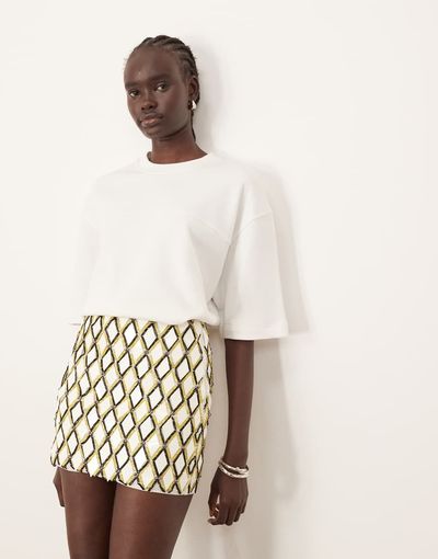 ARRANGE ARRANGE geometric grid embellished mini skirt in white-Multi