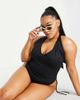 ASOS Curve ASOS DESIGN Curve adjustable leg halter swimsuit in black - 1