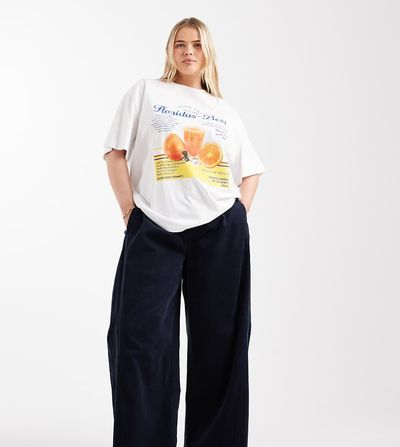 ASOS Curve ASOS DESIGN Curve baby cord extreme horseshoe pants with seam detail in navy-Yellow