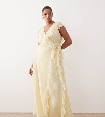 ASOS Curve ASOS DESIGN Curve Bridesmaid wrap front ruffle maxi dress in pale yellow