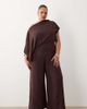 ASOS Curve ASOS DESIGN Curve draped fallen shoulder jumpsuit in fudge-Navy - 1