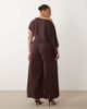 ASOS Curve ASOS DESIGN Curve draped fallen shoulder jumpsuit in fudge-Navy - 4