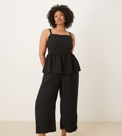 ASOS Curve ASOS DESIGN Curve jumpsuit with peplum waist in black