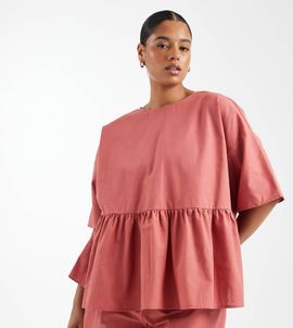 ASOS Curve ASOS DESIGN Curve oversized short sleeve peplum top in blush-pink