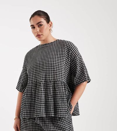 ASOS Curve ASOS DESIGN Curve oversized short sleeve peplum top in check-Multi