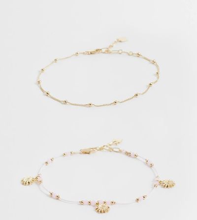 ASOS Curve ASOS DESIGN Curve pack of 2 beaded anklets with sun charms in pink and gold tone