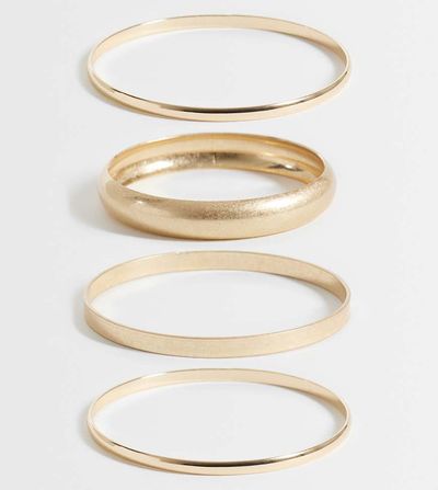 ASOS Curve ASOS DESIGN Curve pack of 4 mixed bangles in gold tone and brushed gold tone