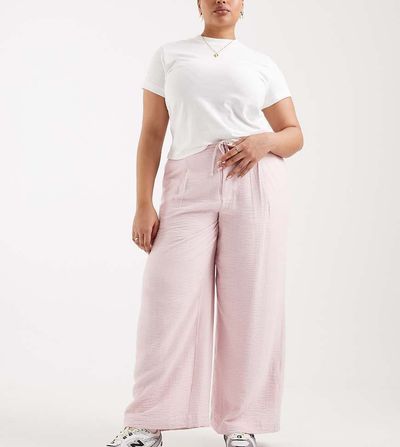 ASOS Curve ASOS DESIGN Curve soft textured wide leg pants in pink