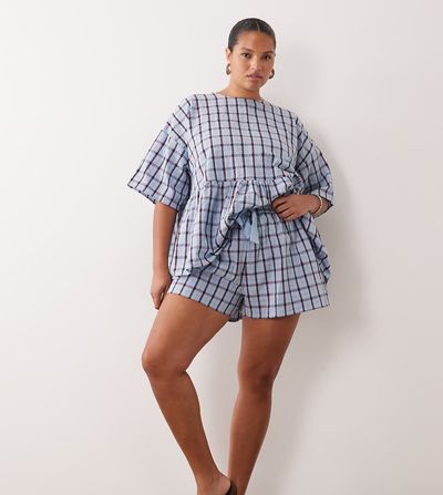 ASOS Curve ASOS DESIGN Curve tie waist pocket detail shorts in blue plaid-Multi