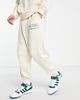 ASOS DESIGN ASOS Actual relaxed brushed cotton sweatpants with multi color logo print in cream - part of a set-White - 1