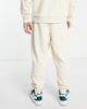 ASOS DESIGN ASOS Actual relaxed brushed cotton sweatpants with multi color logo print in cream - part of a set-White - 3