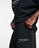 ASOS DESIGN ASOS Dark Future relaxed shorts with logo print in black - 3