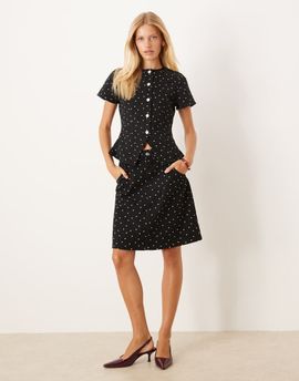 ASOS DESIGN ASOS DESIGN awkward length denim skirt with mini polka dots-Black