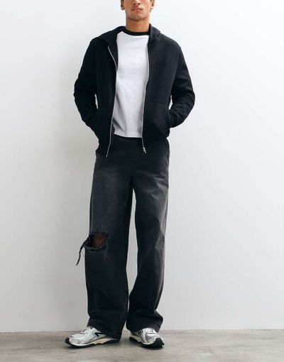ASOS DESIGN ASOS DESIGN baggy jeans in washed black with rips and elasticated waist