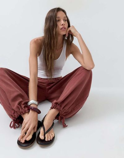 ASOS DESIGN ASOS DESIGN balloon pants with front pockets and adjustable tie hem in rust-Red