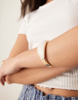 ASOS DESIGN ASOS DESIGN bangle bracelet with faux pearl insert in gold tone