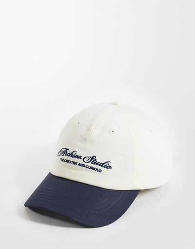 ASOS DESIGN ASOS DESIGN baseball contrast cap with logo graphic in stone and navy
