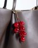 ASOS DESIGN ASOS DESIGN berry bag charm in red - 1