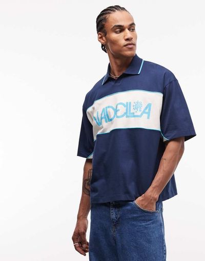 ASOS DESIGN ASOS DESIGN boxy oversized polo shirt with cut and sew paneling and sports graphic in dark blue-Navy