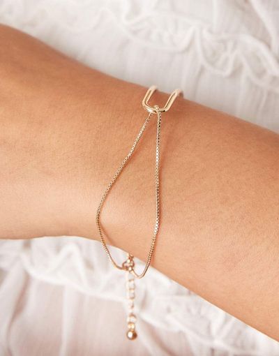 ASOS DESIGN ASOS DESIGN bracelet with dainty cuff and chain detail in gold tone