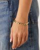 ASOS DESIGN ASOS DESIGN cuff bracelet with green faux stones in gold tone - 1
