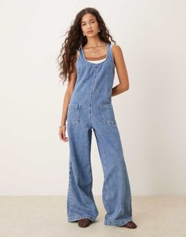 ASOS DESIGN ASOS DESIGN denim overalls jumpsuit with cross back in mid wash-Blue