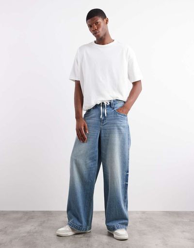 ASOS DESIGN ASOS DESIGN extreme baggy fit jeans with embroidered back pocket in light wash blue