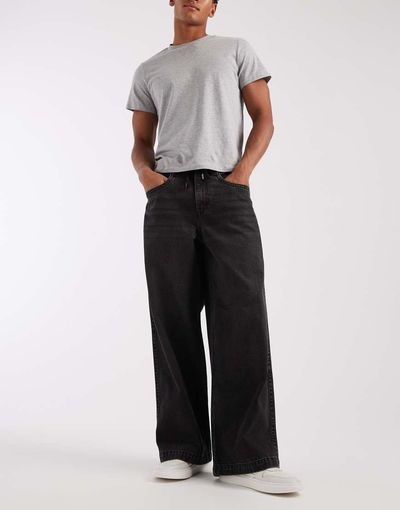 ASOS DESIGN ASOS DESIGN extreme baggy jeans in washed black with embroidered back pockets and tie waist