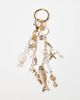ASOS DESIGN ASOS DESIGN fish & faux shell bag charm in gold-Multi - 1