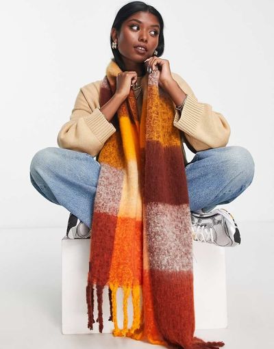 ASOS DESIGN ASOS DESIGN fluffy tassel scarf in orange oversized check-Brown