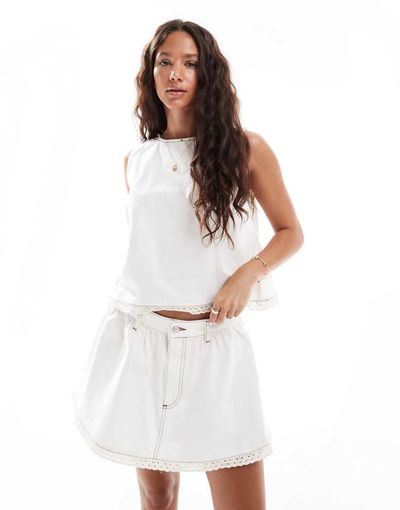 ASOS DESIGN ASOS DESIGN gathered denim micro skirt with eyelet trim in ecru-White
