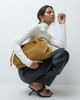 ASOS DESIGN ASOS DESIGN hair on leather drawstring pouch clutch bag with detachable strap in camel-brown-Green - 3