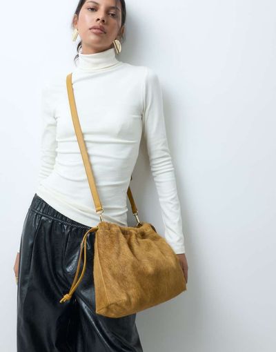 ASOS DESIGN ASOS DESIGN hair on leather drawstring pouch clutch bag with detachable strap in chartreuse-Green