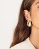 ASOS DESIGN ASOS DESIGN large stud earrings with curved oval design in hammered gold tone - 1