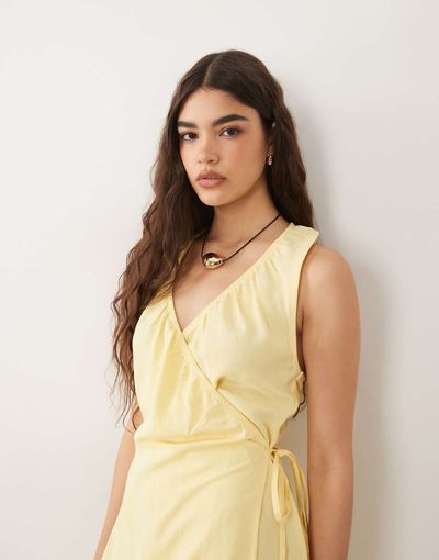 ASOS DESIGN ASOS DESIGN linen blend halter wrap mini dress in buttermilk-Yellow