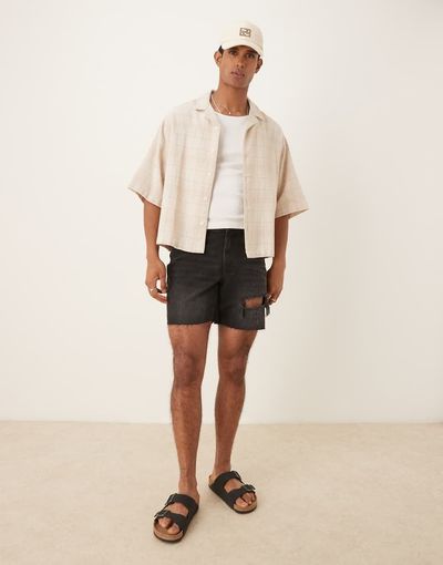 ASOS DESIGN ASOS DESIGN mid length slim denim shorts with rips in black