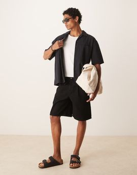 ASOS DESIGN ASOS DESIGN mid length wide denim shorts with tie front in black wash