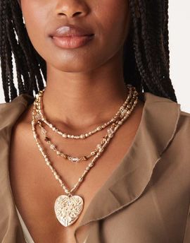 ASOS DESIGN ASOS DESIGN multi-row layered neckace with brown beads and large heart pendant in hammered gold tone