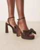 ASOS DESIGN ASOS DESIGN Nala oversized bow platform heel sandals in brown satin - 1
