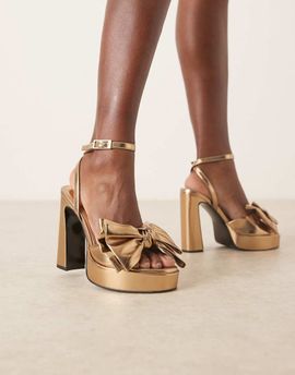 ASOS DESIGN ASOS DESIGN Nala oversized bow platform heel sandals in gold