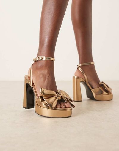 ASOS DESIGN ASOS DESIGN Nala oversized bow platform heel sandals in gold
