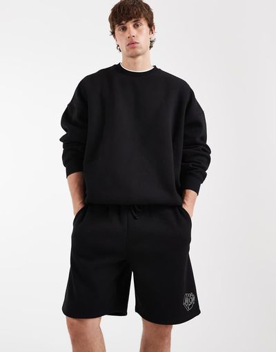 ASOS DESIGN ASOS DESIGN oversized jersey shorts with graphic in black